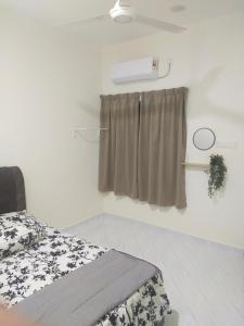 a hospital room with a bed and a window at ABG JEFF HOMESTAYs in Bukit Payong +8 photos