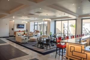 a lobby with tables and chairs and a living room at Ahern Hotel and Event Center in Las Vegas