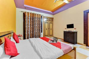 Voodi või voodid majutusasutuse Hotel O Utsav Vatika toas