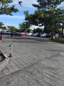 a parking lot with cars parked in a parking lot at Sweet Condo in Seminyak