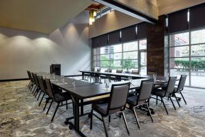 a large conference room with a long table and chairs at Hyatt House Seattle/Redmond in Redmond +57 photos