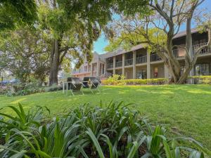 a house with a lawn in front of it at Amoris Guesthouse on Orion in Pretoria