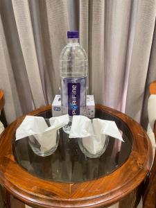a bottle of water sitting on top of a table at Bridge Residency-2 Top City-1 Islamabad in Islamabad