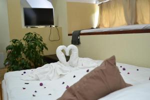 Posteľ alebo postele v izbe v ubytovaní Ezüstfenyő Hotel