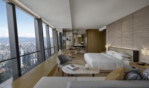 a bedroom with a large bed and large windows at Park Hyatt Kuala Lumpur in Kuala Lumpur +35 photos