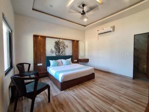 Postel nebo postele na pokoji v ubytování Orchard Hills Resorts