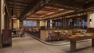 un rendu d'un restaurant avec des tables et des chaises dans l'établissement Taj Paro Resort & Spa, à Paro