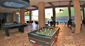 a large room with a pool table and a pool table at Hotel Playa Bonita in Mazatlán