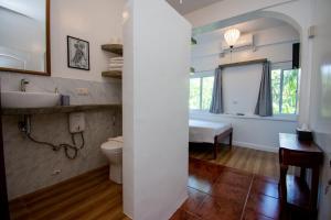 a bathroom with a sink and a toilet at Lanterna Hotel Boracay in Boracay +112 photos