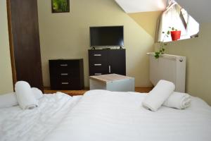 Posteľ alebo postele v izbe v ubytovaní Ezüstfenyő Hotel