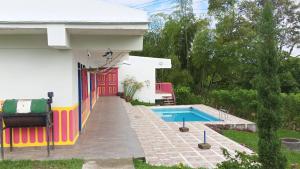 a house with a swimming pool in the yard at Finca El Turpial in Alcalá