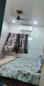 a room with two bunk beds and a sink at New brahmani Bhavan in Dwarka