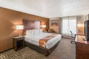 a hotel room with a large bed and a television at Quality Inn & Suites Downtown Walla Walla in Walla Walla +31 photos
