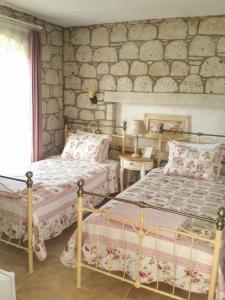 A bed or beds in a room at Kupina Alaçatı