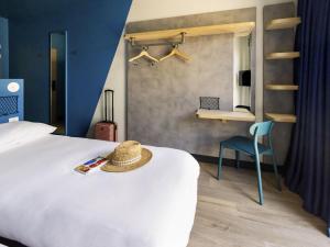 Ένα ή περισσότερα κρεβάτια σε δωμάτιο στο ibis Budget La Rochelle Centre gare +140 φωτογραφίες