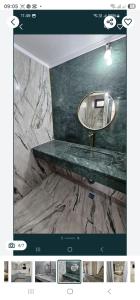 克拉约瓦ZenHome的浴室里有洗手池和镜子