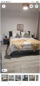 a bedroom with a bed with a blanket on it at ZenHome in Craiova +3 photos