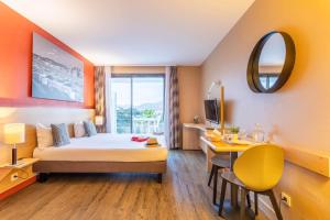 Ένα ή περισσότερα κρεβάτια σε δωμάτιο στο Comfort Aparthotel Marseille Prado