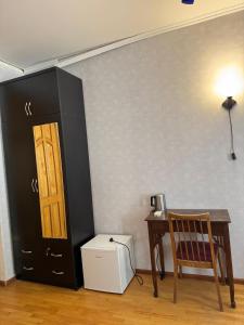 a room with a table and a desk and a door at GNT+ in Tbilisi City