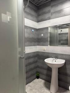 a bathroom with a sink and a mirror at GNT+ in Tbilisi City
