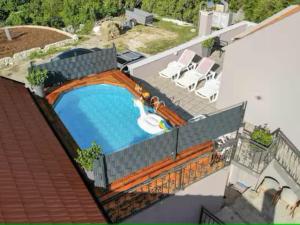 an overhead view of a swimming pool on a house at Nature Beauty with pool and whirlpool in Zagvozd