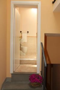 a bathroom with a sink and a toilet in a room at Affittacamere Gir di Mura in Montecatini Terme