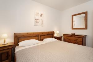 Ένα ή περισσότερα κρεβάτια σε δωμάτιο στο Krug I