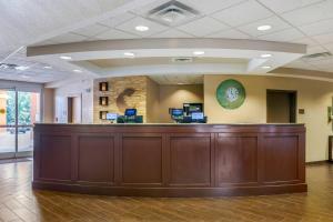 a large lobby with a large wooden reception desk at Comfort Suites Lady Lake - The Villages in The Villages +30 photos