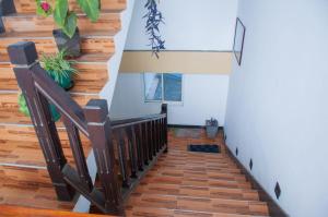 a stairwell with wooden floors and a staircase with wooden railings at Apartment Room - Mathara in Matara