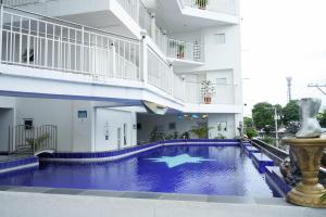 a swimming pool in the middle of a building at One Bedroom Condominium at Kandi Tower 2 in Angeles