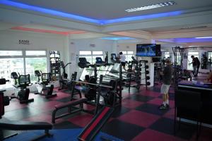 a man in a gym with tread machines at One Bedroom Condominium at Kandi Tower 2 in Angeles