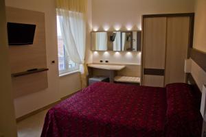 Cama o camas de una habitación en Hotel Siena