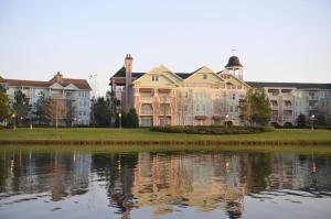 a large building next to a body of water at Disney's Saratoga Springs Resort & Spa in Orlando