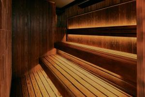 an empty sauna with wood paneled walls at FAV LUX Nagasaki in Nagasaki