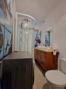a bathroom with a shower and a toilet and a sink at SeaShell Studio Przymorze in Gdańsk