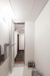a bathroom with a mirror and a sink at Silk Court 201 in Chitose