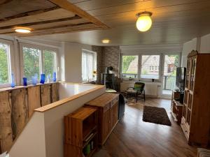 a large living room with a large tub and windows at Kuschelecke in Braunlage +8 photos
