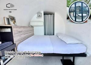a bedroom with a bed and a round mirror at The Cozytainer in Taiping +42 photos