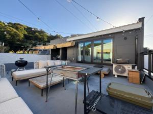 a patio with a couch and a table at Tsubame in Zushi