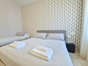 Postel nebo postele na pokoji v ubytování A Casa di Leda - Wi-Fi gratuito & parcheggio - 800 m dal mare