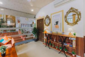 a store lobby with a couch and a mirror at Pvt Pool - Villa Azura Escape - Casa Marialina 8 BR in Saligao