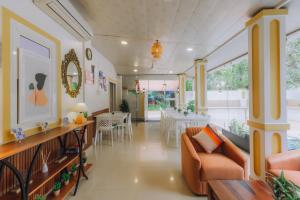 a living room with a couch and a table at Pvt Pool - Villa Azura Escape - Casa Marialina 8 BR in Saligao +22 photos