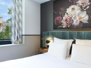 Postel nebo postele na pokoji v ubytování Hotel Les Capitouls Toulouse Centre - Handwritten Collection + 61 fotografií