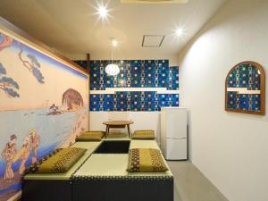 a room with a table and a refrigerator at RetroSpect Stay Yokohama - Vacation STAY 99014v in Yokohama +41 photos