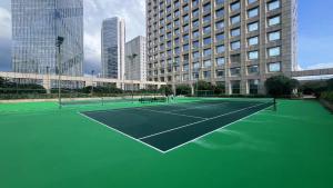 a tennis court in the middle of a city at InterContinental Foshan by IHG - Free Shuttle Bus to Canton Fair in Foshan