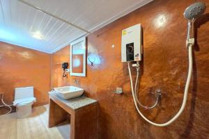 a bathroom with a sink and a shower at Doi Tung View Resort in Mae Sai +104 photos