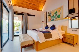 Ένα ή περισσότερα κρεβάτια σε δωμάτιο στο PROMO! 1BR Villa Orchid LaLuxe A10 Sanur