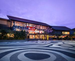 a large building with christmas lights in front of it at Lanmuanghouse in Ban Pa Kluai