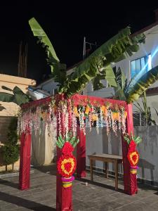 a stage with red and yellow flowers and a bench at Hotel Sun Star International Pvt Ltd in Bhairāhawā +74 photos