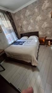 a bedroom with a bed in a room at Viktoriahotel in Tbilisi City